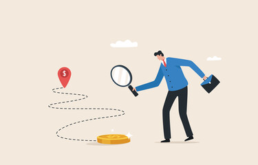 Financial navigation. Path to financial success. Earning extra income or increasing salary.  Businessman holding a magnifying glass to search and track the trace of money.
