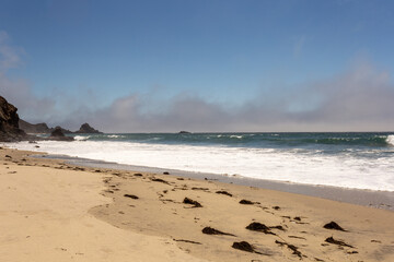 A view on Pacific ocean, cast, rocks and waves