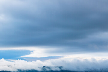 Fototapeta na wymiar Cloud formation over a mountain