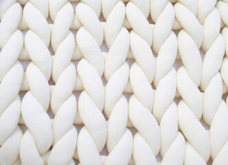 Fabric texture wide knit with white woolen threads. Wallpaper. Background for designers.