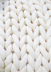 Fabric texture wide knit with white woolen threads. Wallpaper. Background for designers.