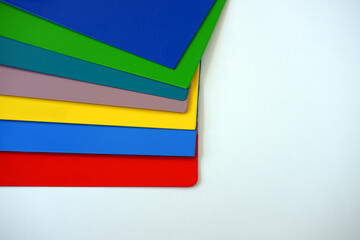 Powder Coatings sample plate. Colorfully painted metal plates on a white background