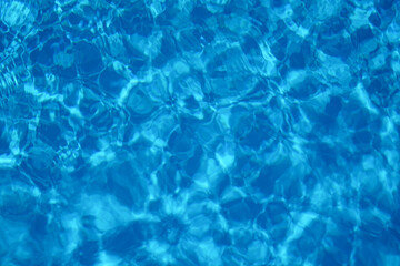 Wavy water surface of swimming pool, top view