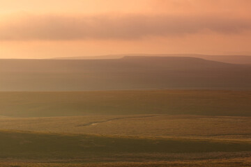 Fototapeta premium Dramatic Lighting over the Pennine Hills at Sunset, North Yorkshire, UK England.