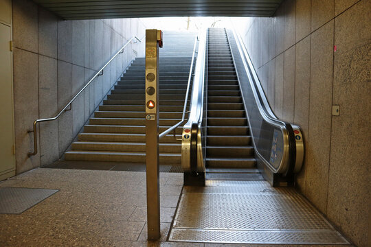 Empty stairway and escalator at a subway station