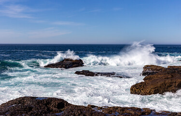 A view on Pacific ocean, cast, rocks and waves