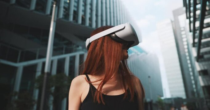 Ginger girl using her new vr glasses in the city
