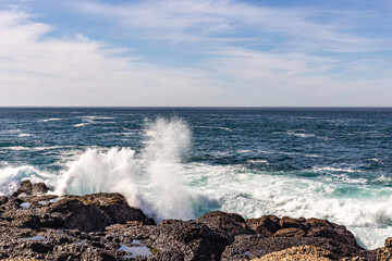 A view on Pacific ocean, cast, rocks and waves