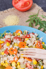 Salad with vegetables and couscous groats. Light and healthy meal containing vitamins and minerals