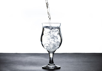 The image of pouring drinking water, into a glass,