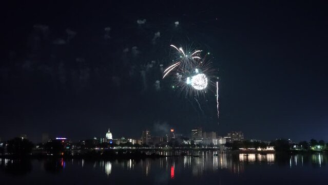 Harrisburg, Pennsylvania - July 4, 2022: Fireworks over the capital city of Harrisburg, Pennsylvania from across the Susquehanna River.