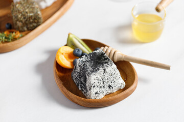 Goat cheese with mold. Cheese little plate with fruits and honey.