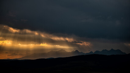 Naklejka na ściany i meble Silhouettes of the mountains against the sunset. Tatra Mountains, Slovakia.