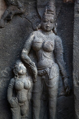 Fototapeta na wymiar A sculpture of beautiful women at Kailash Temple at Ellora, Maharashtra, India.