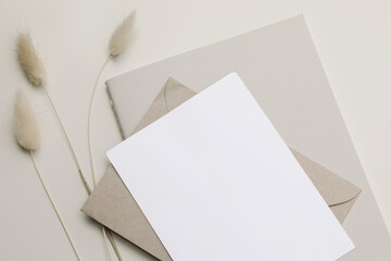 Closeup of empty paper greeting card, invitation and diary mockup. Boho stationery still life....