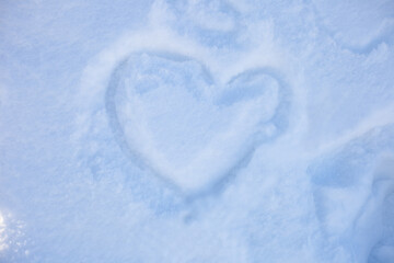 on the blue snow painted with a finger heart