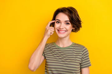 Fototapeta premium Closeup photo of young lady wear khaki t-shirt thinking smart how solve money problems isolated on yellow color background