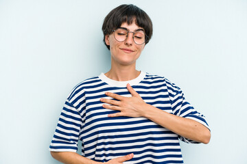 Young caucasian woman with a short hair cut isolated laughs happily and has fun keeping hands on...