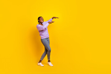 Fototapeta na wymiar Full length photo of carefree cheerful person have fun dancing partying isolated on yellow color background