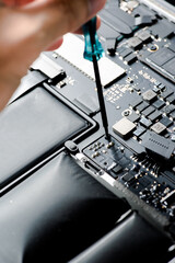 close up of Technician repairing electronic circuit board, repairing, upgrade and technology.