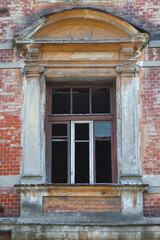 Window with broken glass in an old house.