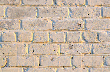 Old white brick wall. Ancient stone texture background. Urban background, white ruined industrial brick wall with copy space. Home and office design backdrop. Vintage effect. 