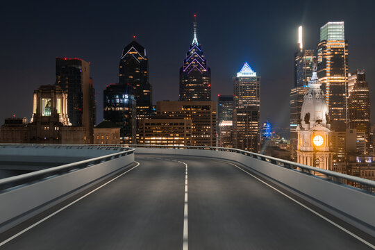 Empty urban asphalt road exterior with city buildings background. New modern highway concrete construction. Concept way to success. Transportation logistic industry fast delivery. Philadelphia. USA. © VideoFlow