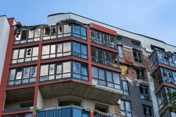 House in of civilians destroyed by russian army in the suburbs of Kyiv (Irpin). Traces on the building from shells. russia's war against Ukraine.