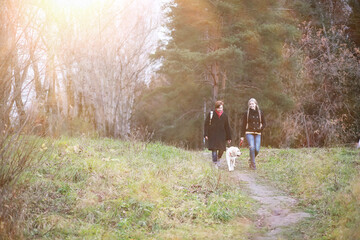 Fototapeta premium Young girl on a walk in the autumn