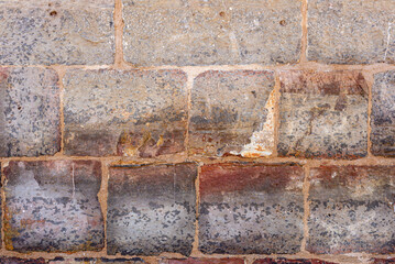 texture of a stone brick wall without finishing