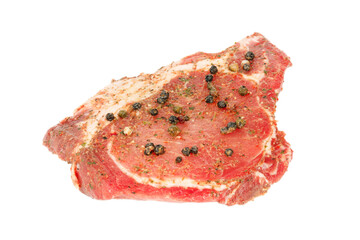 Marinated meat with spices on a white background.