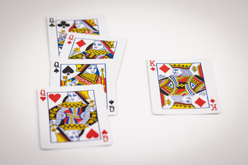 Conceptual layout of playing cards with queen and king facing each other