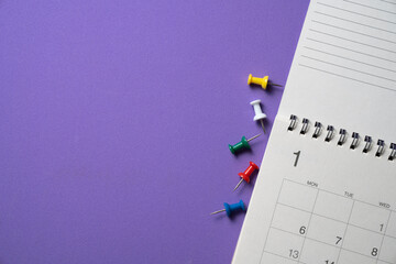 close up of calendar and pin on the purple table background, planning for business meeting or...