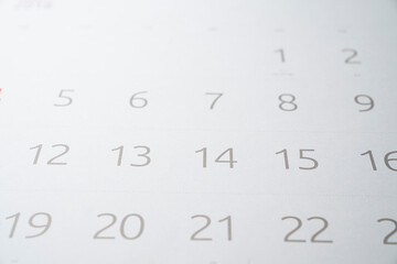 Obraz premium close up of number on calendar on the table background, planning for business meeting or travel planning concept
