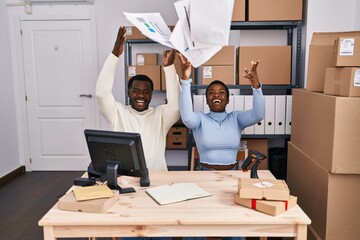 Man and woman ecommerce business workers throwing paperwork at office