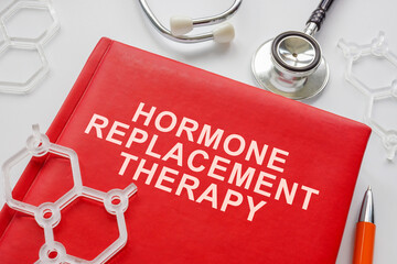 Book about hormone replacement therapy and molecule models. - obrazy, fototapety, plakaty