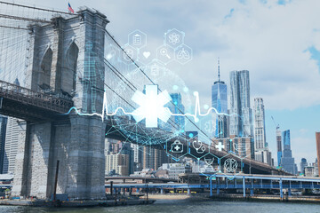 Fototapeta na wymiar Brooklyn bridge with New York City Manhattan, financial downtown skyline panorama at day time over East River. Health care digital medicine hologram. The concept of treatment and disease prevention