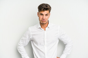 Young caucasian man isolated on white background sad, serious face, feeling miserable and displeased.