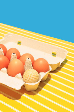 Naklejki Bright image of eggs in box on bright yellow tablecloths isolated on blue background. Village breakfast
