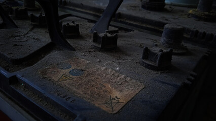 Magelang, Indonesia - July 25th 2022 : many used car batteries waiting to be recycled in an environmentally harmful scrap yard