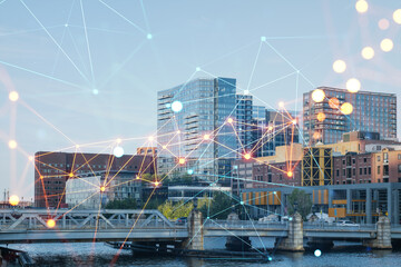Panorama city view of Boston Harbor at day time, Massachusetts. Buildings of financial downtown. Glowing Social media icons. The concept of networking and establishing new connections between people