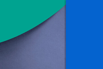Textured and plain green blue purple sheet papers forming a curve and vertical blank rectangle for creative cover designing