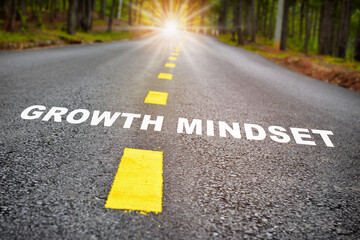 Growth mindset with sunbeam on road surface. Journey to self development to success concept and challenge idea - obrazy, fototapety, plakaty