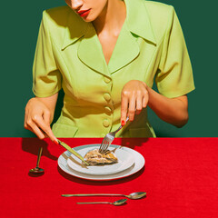Cropped image of woman eating oyster on red tablecloth isolated over green background. Delicious taste - obrazy, fototapety, plakaty