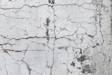 Obraz premium Closeup of badly fixed building facade wall covered with cracks in stucco and paint.