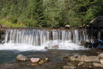 Obraz premium waterfall in the mountains in summer