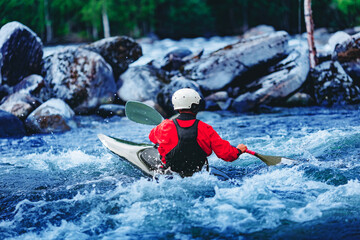 Extreme sport kayaker, back view man in boat kayak whitewater rafting, blue water