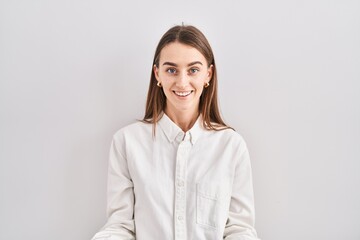 Young caucasian woman standing over isolated background smiling cheerful with open arms as friendly welcome, positive and confident greetings