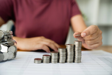 Woman with coin stack. Financial Growing savings concept. Saving money by hand putting coins money accounting planning