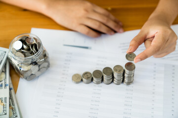 Woman with coin stack. Financial Growing savings concept. Saving money by hand putting coins money accounting planning